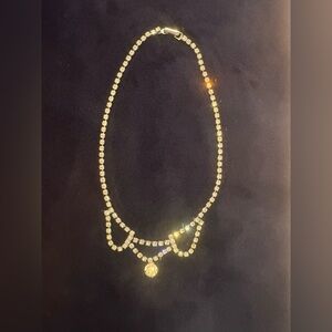 Silver tone, crystal, choker style necklace.